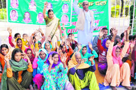 Women from Sahaspur block under the banner of the Rashtriya Lok Dal stage a demonstration at the Gandhi Park, Dehradun, on Thursday.