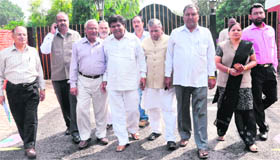 BJP leaders come out of the Raj Bhawan in Chandigarh after submitting a memorandum to the Governor regarding the alleged violation of the municipal Act by the government in the functioning of the  Panchkula MC, on Thursday.