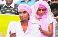Artistes enact a nukkad play Kahin Der Na Ho Jaye in Ludhiana. 