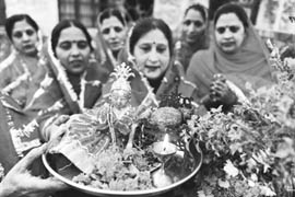 Devotees offer prayers as they celebrate a traditional Tulsi Vivah at a temple in Amritsar