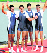Ranjit Singh, Anil Kumar, Jenil Krishnan and Saji Thomas pose after they finished second in the men's four rowing event of 16th Asian Games 