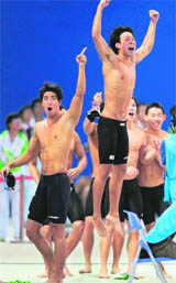 The Japanese medley relay team celebrate after China were disqualified elevating Japan to first place in the men's 4x100m medley relay final