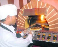 Roman Dome or Black oven is a radiant oven made of stone. It rotates 360 degrees. 