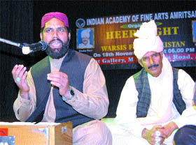 Pakistani Sufi singers Khadim Husan Warsi and Husnan Akbar perform at the Heer Night in Amritsar. 