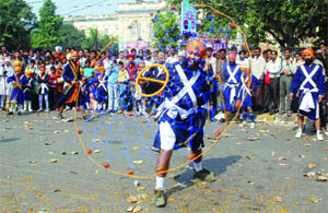 Sikh devotees perform gatka at a nagar kirtan on the birth anniversary of Guru Nanak Devji at the Sis Ganj Gurdwara in Chandni Chowk, Delhi, on Friday.