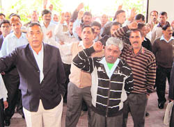 GMVN employees hold a protest in Dehradun on Friday