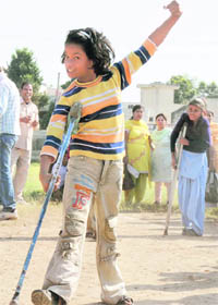 Pooja, winner of a 25-metre race, at the Children with Special Needs meet in Karnal on Friday.