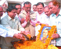 Congress leaders garland the portrait of former Prime Minister of India Indira Gandhi on the occasion of her birth anniversary in Jalandhar on Friday