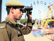 A securityman keeps vigil during the Jhiri Fair in Jammu on Friday