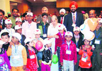 Punjab Health and Family Welfare Minister Laxmi Kanta Chawla flanked by children who were surgically treated for heart diseases at the CMCH, Ludhiana, on Friday.