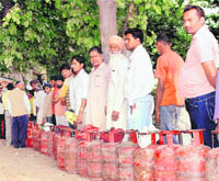 People queue up to get cooking gas in Rajpura. 