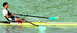 Bajrang Lai Takhar of India competes in the men's single sculls final during the 16th Asian Games in Guangzhou on Friday