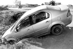 A car that fell in a ditch on the Chandigarh-Ambala highway at Dera Bassi 
