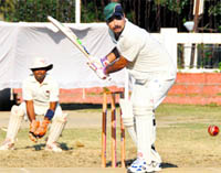 Players in action during a match of the Inter-departmental ONGC Cricket Tournament under way in Dehradun on Saturday