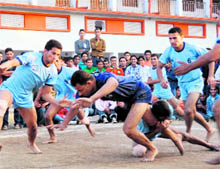 A match of the Hemwati Nandan Bahuguna Garhwal University Inter-college Kabaddi Tournament under way in Dehradun on Saturday