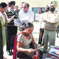 Shingara Ram, Principal Secretary, Election Commission of India, takes stock of the progress of revision of voter lists at a booth in Nawanshahr