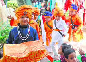 Children at a function organised to celebrate Gurpurb at Bachpan Playway School in Jammu on Saturday.