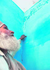 Sukhdev Singh shows the cracks in his house after the explosion.