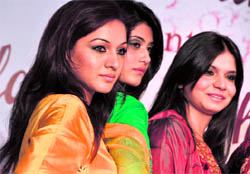 Models present a collection during the fashion carnival in Ludhiana on Saturday.