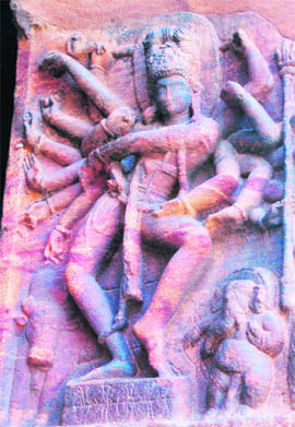 The multi-armed Siva, carved on the wall of a cave