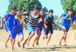 Girls take part in a race at the panchayat games in Dehradun on Sunday