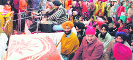 Devotees listen to kirtan at a gurdwara in Srinagar on Sunday.