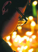 A girl celebrates Gurpurb by lighting candles inside Dukh Nivaran Sahib Gurdwara in Ludhiana on Sunday.
