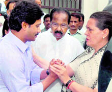 A file photo of the UPA Chairperson Sonia Gandhi, Congress MP Jaganmohan Reddy and the Union Law Minister Veerappa Moily in Hyderabad. The Congress high command has sought a report from its Andhra Pradesh unit on a programme aired by a TV channel owned by Jagan attacking Sonia Gandhi