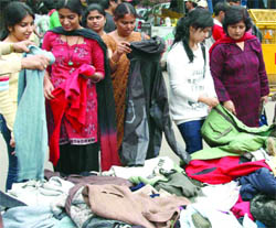 People buy woollen clothes at Palika Bazar, Connaught Place, New Delhi, as temperature came down