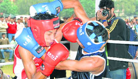 A bout in progress at the Parade Ground, Dehradun, on Monday.