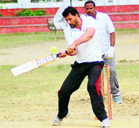 A player in action in the Above-45 Inter-Departmental ONGC Softball Cricket Tournament in Dehradun on Monday.
