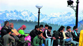 People enjoy change in the weather in Shimla on Monday.