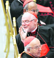 New cardinal Reinhard Marx of Germany turns to talk with his relatives as Pope Benedict XVI leads a special audience in Paul VI hall at the Vatican on Monday.