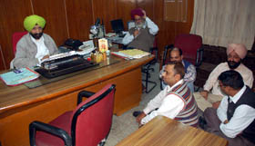 Staff of the Satluj Gramin Bank, Civil Lines, Bathinda, staging a dharna in the office of the chairman of the bank, KJS Dhillon, on Tuesday evening.