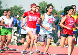 Women athletes slug it out during the All-India Civil Services Athletics Championship at Tau Devi Lal Stadium, Panchkula, on Tuesday