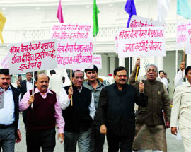 Bharatiya Janata Party MLAs protest against the Delhi government, demanding the resignation of Chief Minister Sheila Dikshit over the alleged corruption in the Commonwealth Games, at the Delhi Vidhan Sabha on Tuesday.