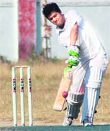 A batsman hits a shot at the Uttarakhand Technical University Cricket Tournament in Dehradun on Tuesday.