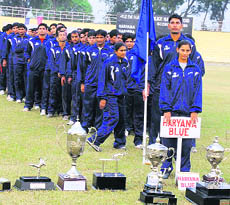 The Haryana Blue contingent with trophies at the 42nd Haryana Police Games in Madhuban in Karnal on Tuesday.