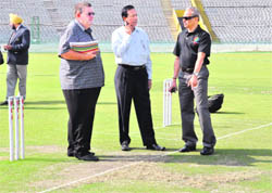 ICC team members inspect the pitch at the PCA stadium in Mohali