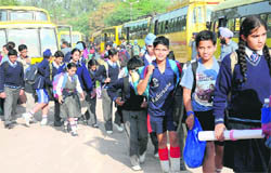 While most schools remained closed on the occasion of the martyrdom day of Guru Tegh Bahadur, students of St Kabir School, Sector 26, come out of buses to attend their classes