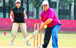 Two players in action at the Women Cosco Ball Cricket Tournament in Dehradun