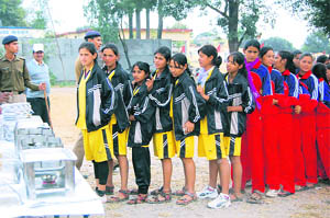 Sportspersons stand in a food queue at the panchayat games at Inter College, Balawala, near Dehradun
