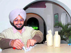 A health official takes samples of the flavour at a hookah joint in Sarabha Nagar