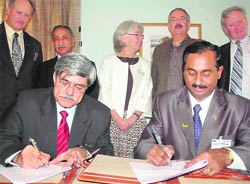 Dr Rakesh Tuli and Venkatesh Meda sign an MoU in Chandigarh on Wednesday