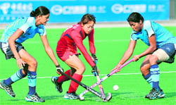 Kaori Chiba (C) of Japan vies for ball with Kirandeep Kaur (L) and Deepika during their bronze medal match on Wednesday. Japan beat India 1-0