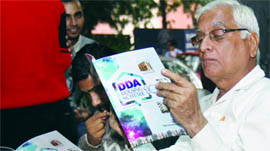 A man goes through a DDA housing form in New Delhi on Thursday.