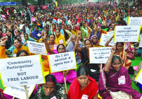 Members of the All India Coordination Committee of midday meal workers demand regularisation of their services at Jantar Mantar in New Delhi on Thursday.