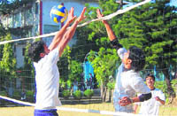 A volleyball match under way at the sports day of GRD (PG) College in Dehradun