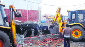 An illegal structure being razed in Ballabgarh on Thursday.