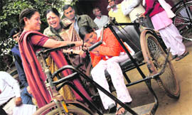 Asha Hooda, CMs wife (centre), with a physically challenged girl at a function in Sohna on Thursday.